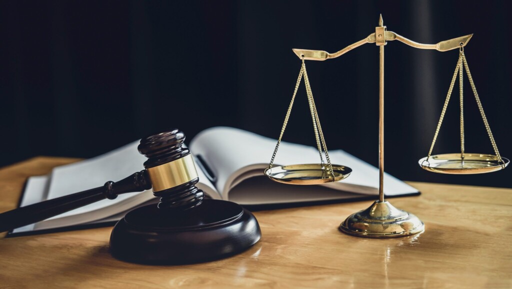 Judge gavel with Scale of justice, object documents working on table in courtroom, Legal law advice and justice concept.