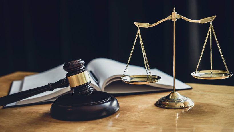 Judge gavel with Scale of justice, object documents working on table in courtroom, Legal law advice and justice concept.
